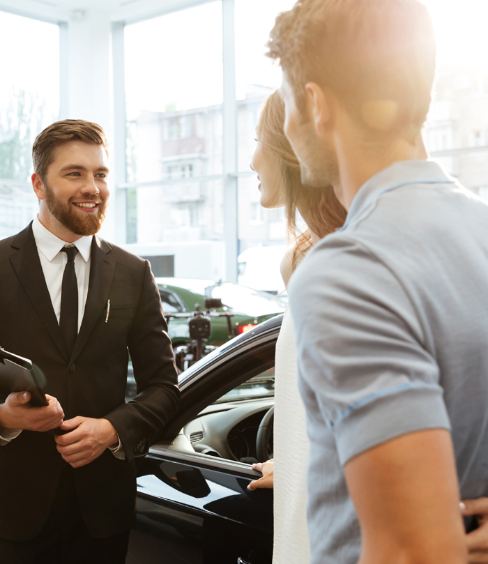 Customers buying car from car dealer