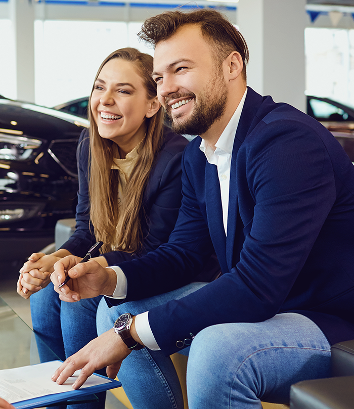 Customers buying car from car dealer